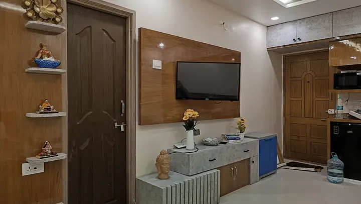 Living area with wall-mounted TV and console